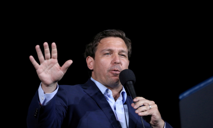 FILE PHOTO: Florida Governor Ron Desantis speaks during a campaign rally by U.S. President Donald Trump at Pensacola International Airport in Pensacola, Florida, U.S., October 23, 2020. REUTERS/Tom Brenner/File Photo/File Photo